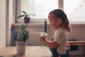 child-watering-plants